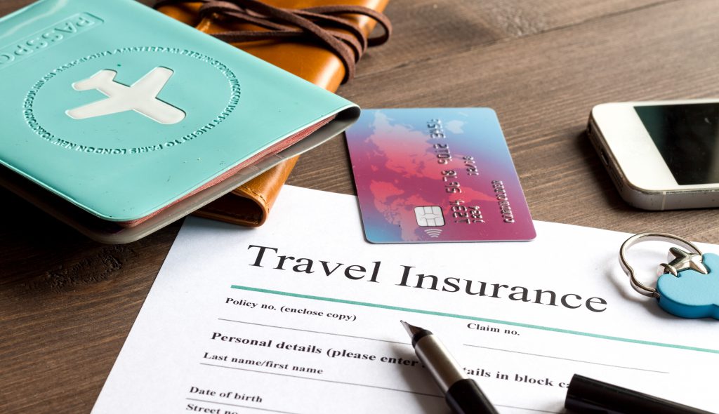 Photo of Travel Insurance Documents, Passport, and Credit Card